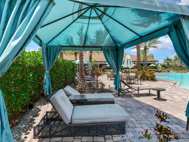 5317 Rushmere Ct, Palmetto, FL 34221 - view of patio with a gazebo and a community pool