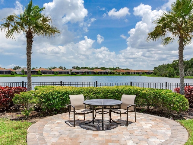 5317 Rushmere Ct, Palmetto, FL 34221 - view of patio with a water view, outdoor dining area, and a residential view