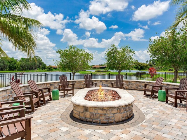 5317 Rushmere Ct, Palmetto, FL 34221 - view of patio featuring a fire pit and a water view