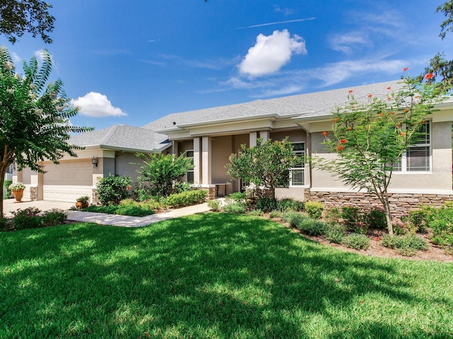 3503 Graycliff Ln, Brandon, FL 33511 - view of front of house featuring stucco siding, a front lawn, and stone siding