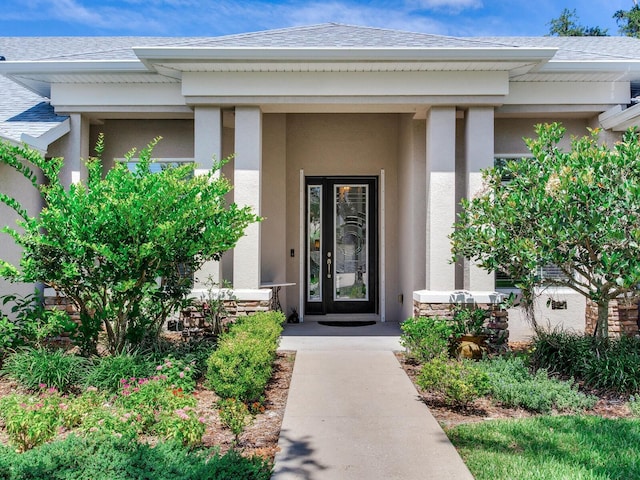 3503 Graycliff Ln, Brandon, FL 33511 - doorway to property with stucco siding, a shingled roof, and covered porch