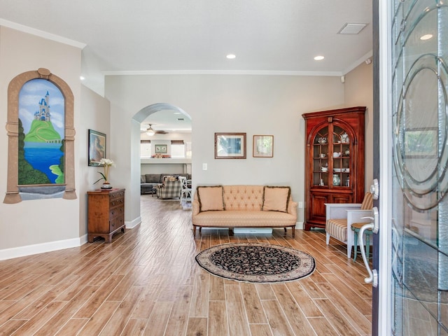 3503 Graycliff Ln, Brandon, FL 33511 - living room with crown molding, wood finished floors, arched walkways, ceiling fan, and recessed lighting