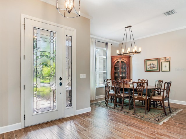 3503 Graycliff Ln, Brandon, FL 33511 - entrance foyer with a chandelier, wood finished floors, and ornamental molding