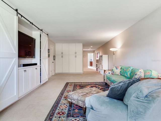 3503 Graycliff Ln, Brandon, FL 33511 - living area featuring a barn door and light colored carpet