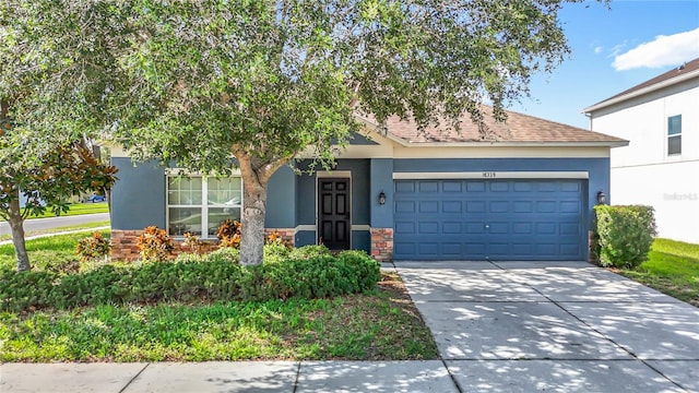 18339 Fish Loop, Land O Lakes, FL 34638 - view of front of house featuring stucco siding, an attached garage, stone siding, driveway, and a shingled roof
