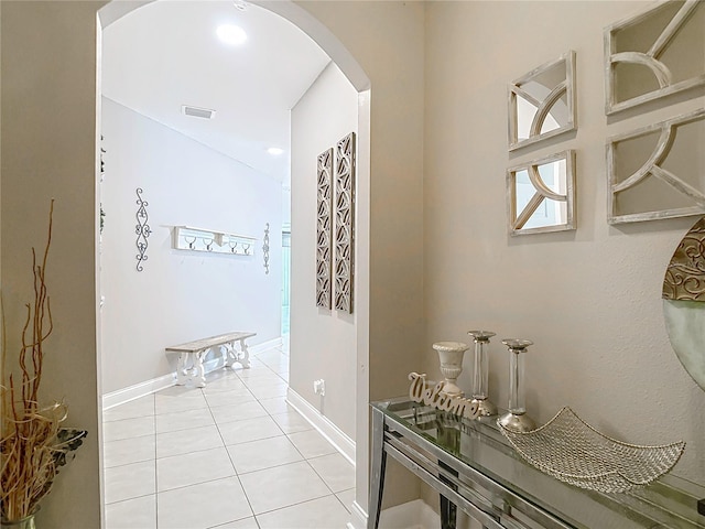 18339 Fish Loop, Land O Lakes, FL 34638 - hallway with arched walkways and light tile patterned floors