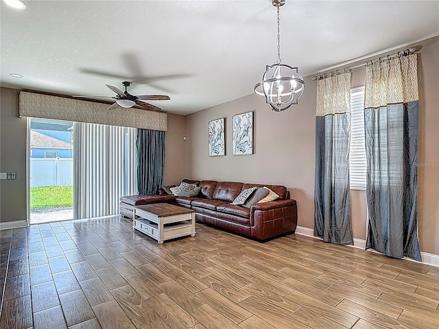 18339 Fish Loop, Land O Lakes, FL 34638 - living room with a chandelier, wood finish floors, plenty of natural light, and ceiling fan