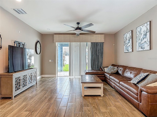 18339 Fish Loop, Land O Lakes, FL 34638 - living area with a ceiling fan and light wood-style flooring