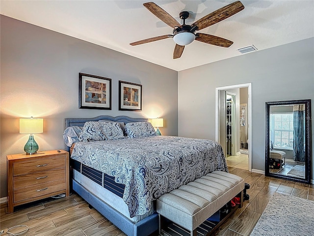 18339 Fish Loop, Land O Lakes, FL 34638 - bedroom with wood tiled floors and a ceiling fan