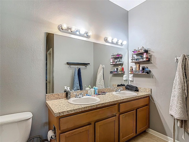 18339 Fish Loop, Land O Lakes, FL 34638 - bathroom featuring double vanity and toilet