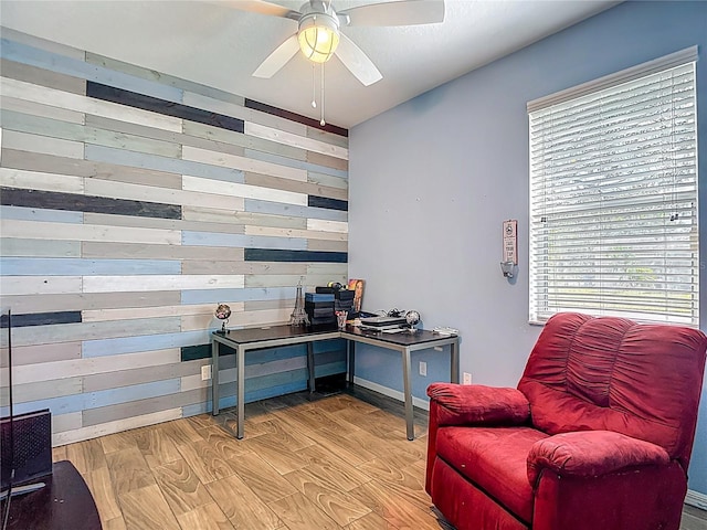 18339 Fish Loop, Land O Lakes, FL 34638 - home office featuring wooden walls, healthy amount of natural light, light wood-style floors, and a ceiling fan