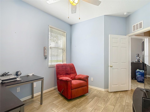 18339 Fish Loop, Land O Lakes, FL 34638 - sitting room with wood tiled floors and a ceiling fan