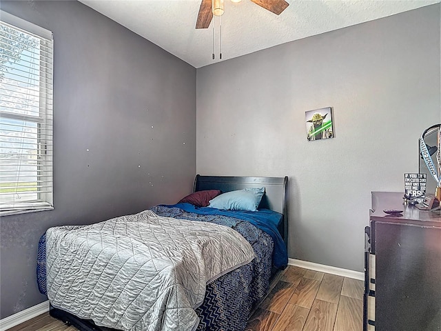 18339 Fish Loop, Land O Lakes, FL 34638 - bedroom featuring wood finished floors and a ceiling fan