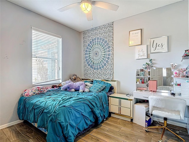 18339 Fish Loop, Land O Lakes, FL 34638 - bedroom featuring light wood-style floors, ceiling fan, and an office area