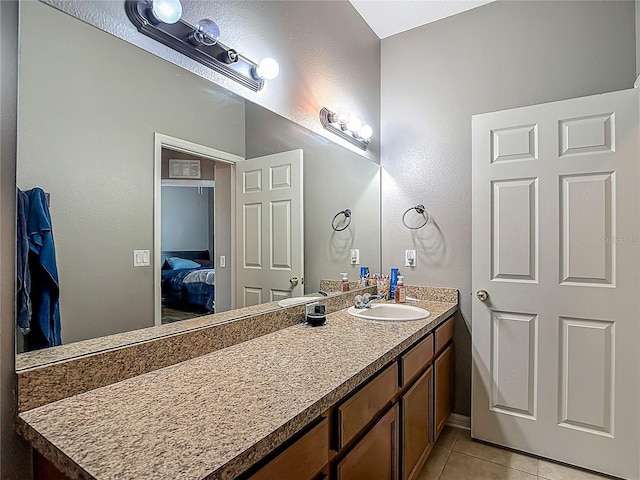 18339 Fish Loop, Land O Lakes, FL 34638 - bathroom with tile patterned floors, vanity, and connected bathroom