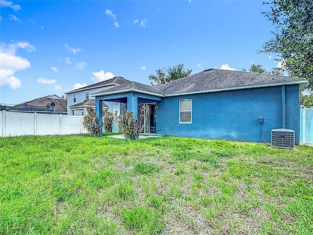 18339 Fish Loop, Land O Lakes, FL 34638 - rear view of house with stucco siding
