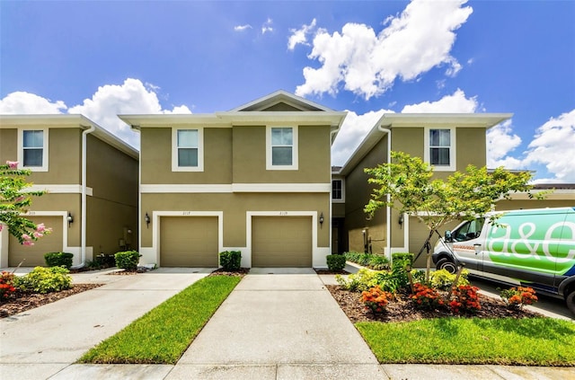 2119 Broadway View Ave, Brandon, FL 33510 - view of front of house featuring stucco siding, an attached garage, and concrete driveway