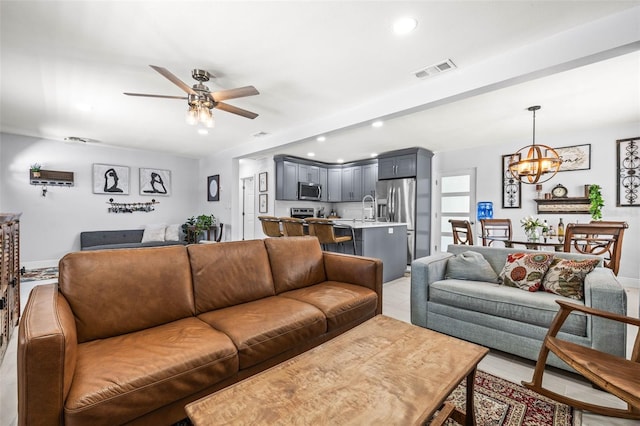 1406 Nebraska Ave, Palm Harbor, FL 34683 - living room with ceiling fan, a chandelier, and recessed lighting
