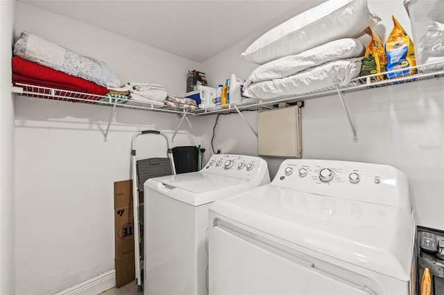 1406 Nebraska Ave, Palm Harbor, FL 34683 - washroom with washing machine and clothes dryer and baseboards