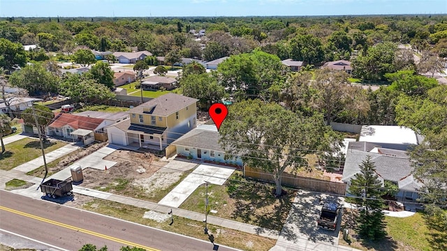 1406 Nebraska Ave, Palm Harbor, FL 34683 - aerial perspective of suburban area with a forest