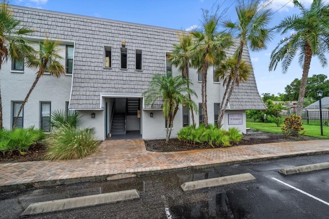 720 Lyndhurst St Unit 1101, Dunedin, FL 34698 - view of front of house featuring uncovered parking and stucco siding