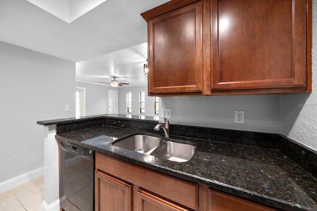720 Lyndhurst St Unit 1101, Dunedin, FL 34698 - kitchen with black dishwasher, dark stone countertops, light tile patterned floors, ceiling fan, and brown cabinetry