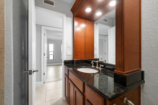 720 Lyndhurst St Unit 1101, Dunedin, FL 34698 - bathroom with tile patterned floors, a textured wall, and vanity