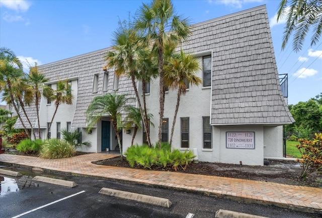 720 Lyndhurst St Unit 1101, Dunedin, FL 34698 - view of property featuring uncovered parking