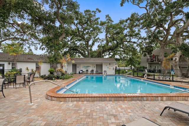 720 Lyndhurst St Unit 1101, Dunedin, FL 34698 - community pool featuring a patio area