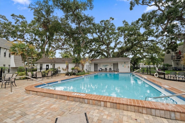 720 Lyndhurst St Unit 1101, Dunedin, FL 34698 - community pool featuring a patio