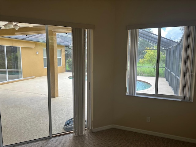 1353 El Pardo Dr, Trinity, FL 34655 - entryway featuring carpet floors, plenty of natural light, and a ceiling fan
