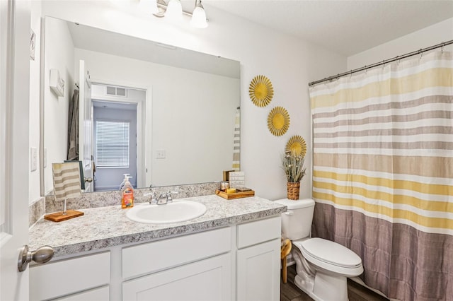 6235 Bucket Ct, Gibsonton, FL 33534 - bathroom featuring vanity, a shower with shower curtain, and wood finished floors