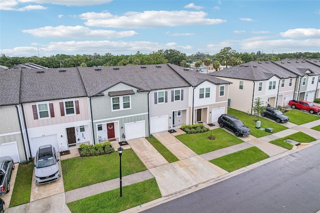 6235 Bucket Ct, Gibsonton, FL 33534 - multi unit property featuring driveway, a residential view, an attached garage, a front lawn, and board and batten siding