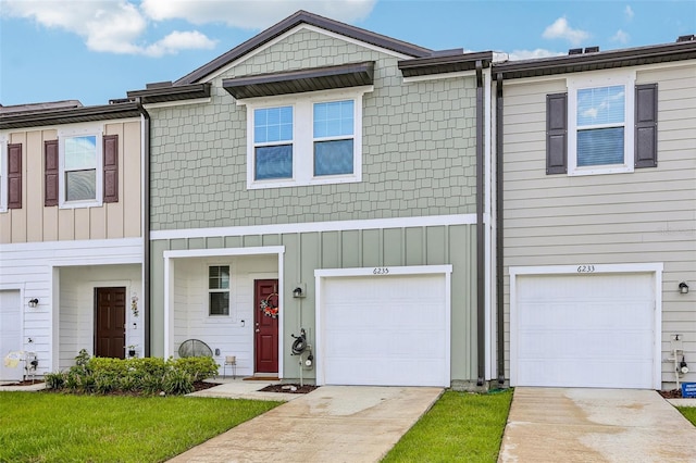 6235 Bucket Ct, Gibsonton, FL 33534 - townhome / multi-family property with driveway and a garage