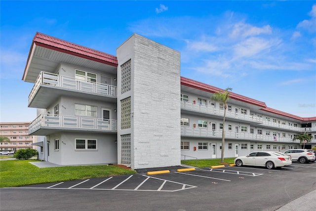 5660 80th St N Unit B106, Saint Petersburg, FL 33709 - view of apartment building / complex with uncovered parking