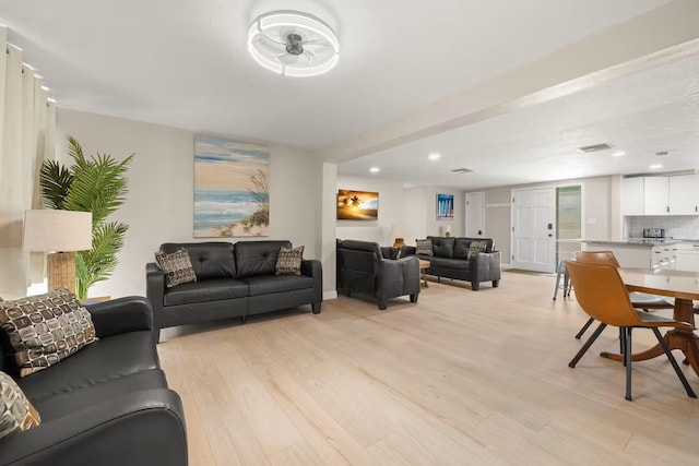 201 S St, Palm Harbor, FL 34683 - living room with light wood-style flooring and recessed lighting