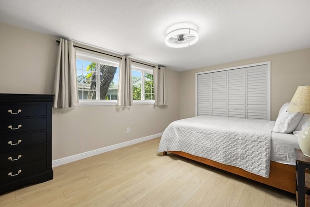 201 S St, Palm Harbor, FL 34683 - bedroom with light wood-type flooring and a closet