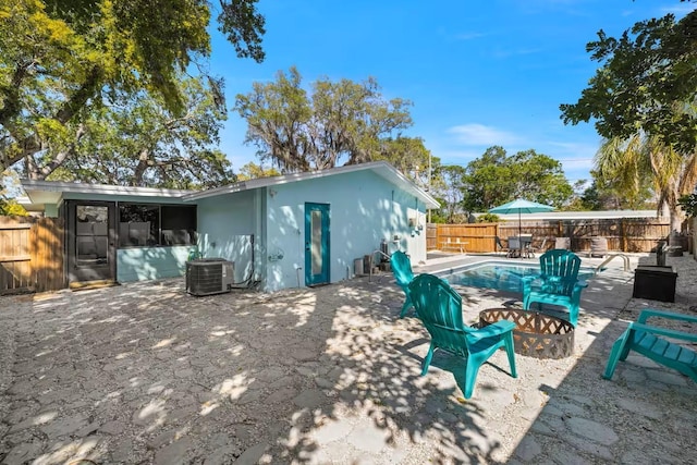 201 S St, Palm Harbor, FL 34683 - exterior space with a fenced backyard and a fire pit