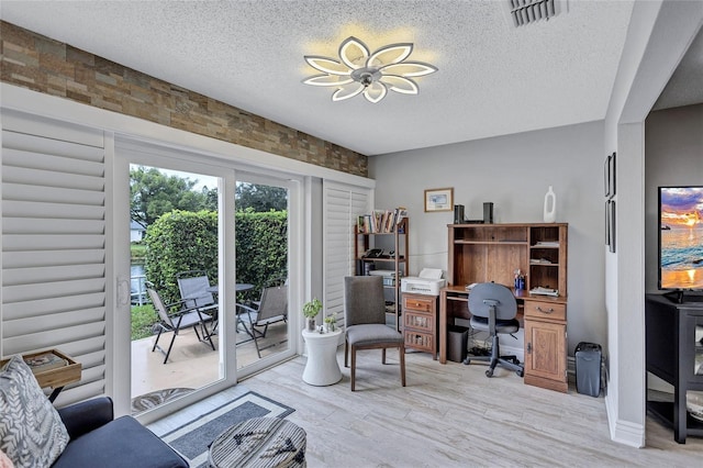 900 Maclaren Dr N Unit D, Palm Harbor, FL 34684 - office with a textured ceiling and light wood finished floors