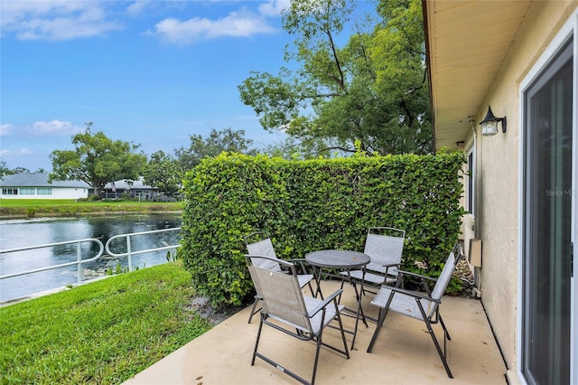900 Maclaren Dr N Unit D, Palm Harbor, FL 34684 - view of patio featuring a water view