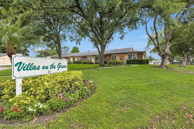 900 Maclaren Dr N Unit D, Palm Harbor, FL 34684 - community / neighborhood sign with a lawn