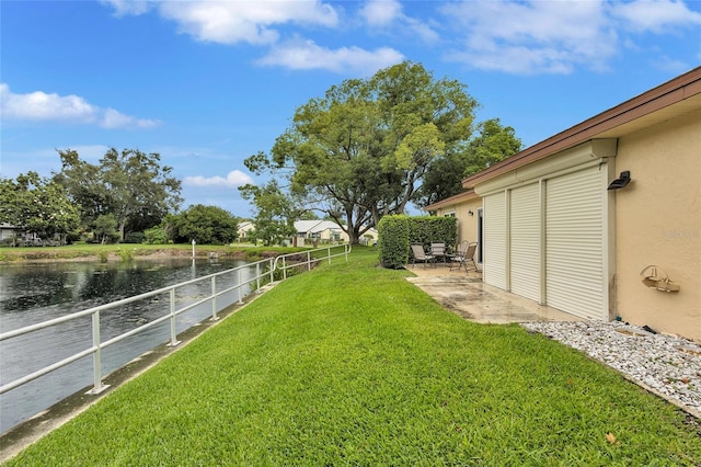 900 Maclaren Dr N Unit D, Palm Harbor, FL 34684 - view of yard with a water view and a patio area