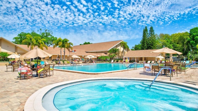 900 Maclaren Dr N Unit D, Palm Harbor, FL 34684 - community pool with a patio
