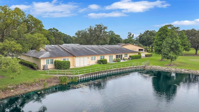 900 Maclaren Dr N Unit D, Palm Harbor, FL 34684 - rear view of house featuring a yard and a water view
