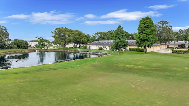 900 Maclaren Dr N Unit D, Palm Harbor, FL 34684 - view of property's community with a water view, view of golf course, and a yard