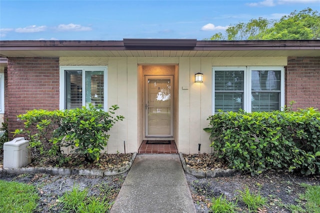 900 Maclaren Dr N Unit D, Palm Harbor, FL 34684 - view of exterior entry with brick siding