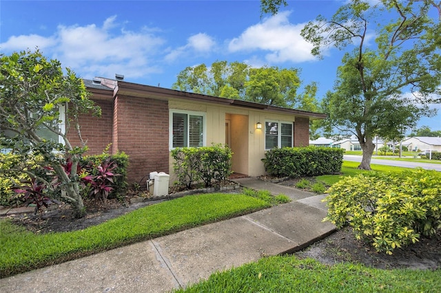 900 Maclaren Dr N Unit D, Palm Harbor, FL 34684 - view of front facade featuring brick siding