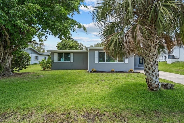 2701 Camellia Ter, Punta Gorda, FL 33950 - view of front facade with stucco siding and a front yard