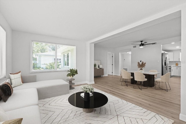 2701 Camellia Ter, Punta Gorda, FL 33950 - living room featuring light wood finished floors and a ceiling fan
