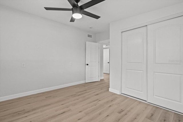 2701 Camellia Ter, Punta Gorda, FL 33950 - unfurnished bedroom featuring light wood-style floors, a closet, and ceiling fan
